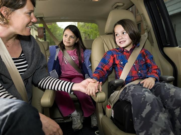 Kid Car | children happily & safely secured in a vehicle