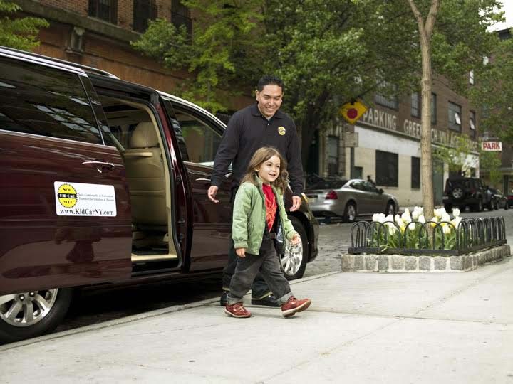 Kid Car | staff helping child safely exit vehicle